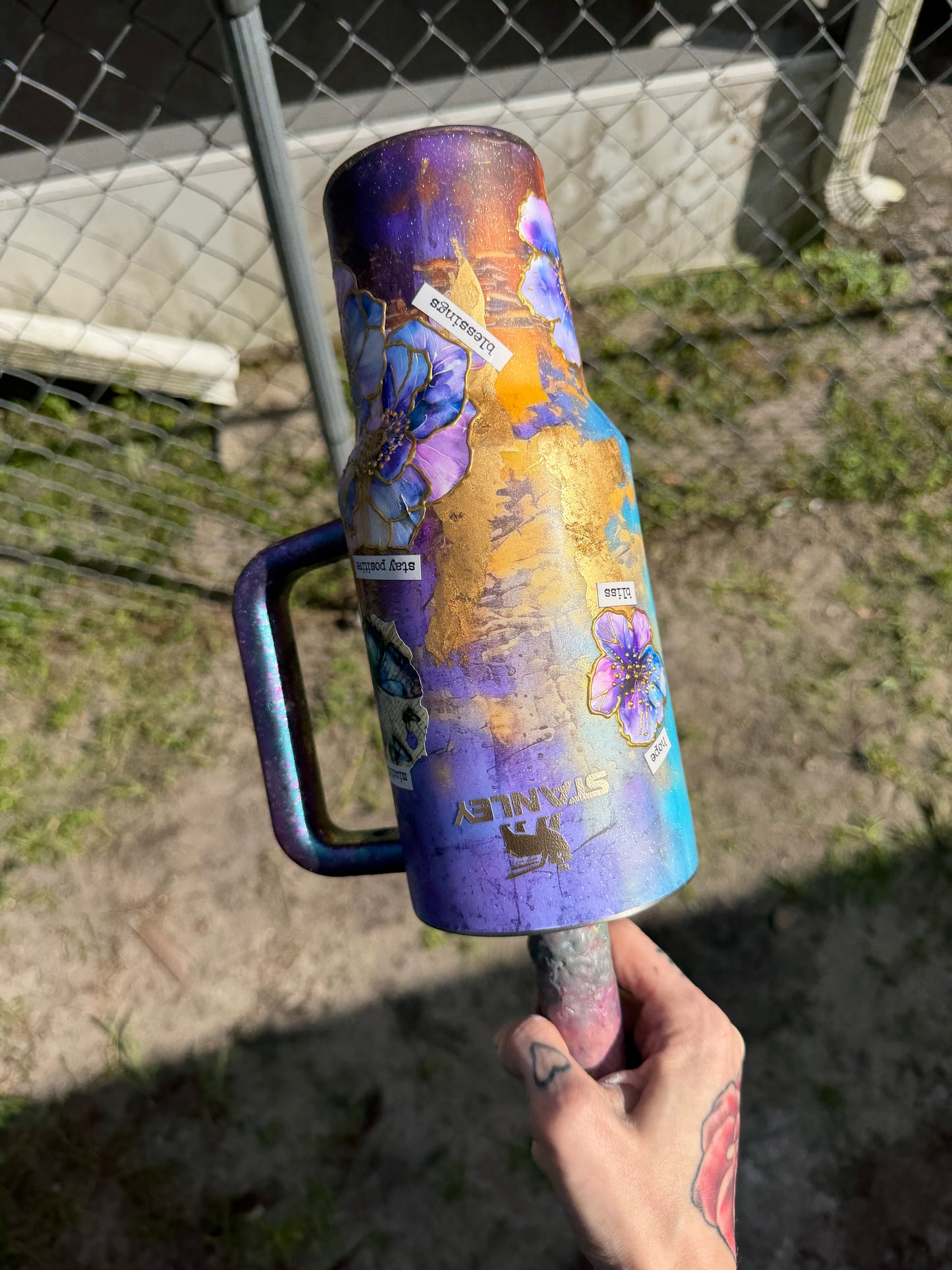 40 Oz Stanley , purple flower with gold outline